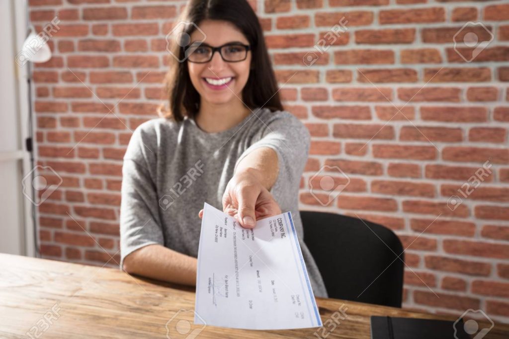 woman offering company cheque